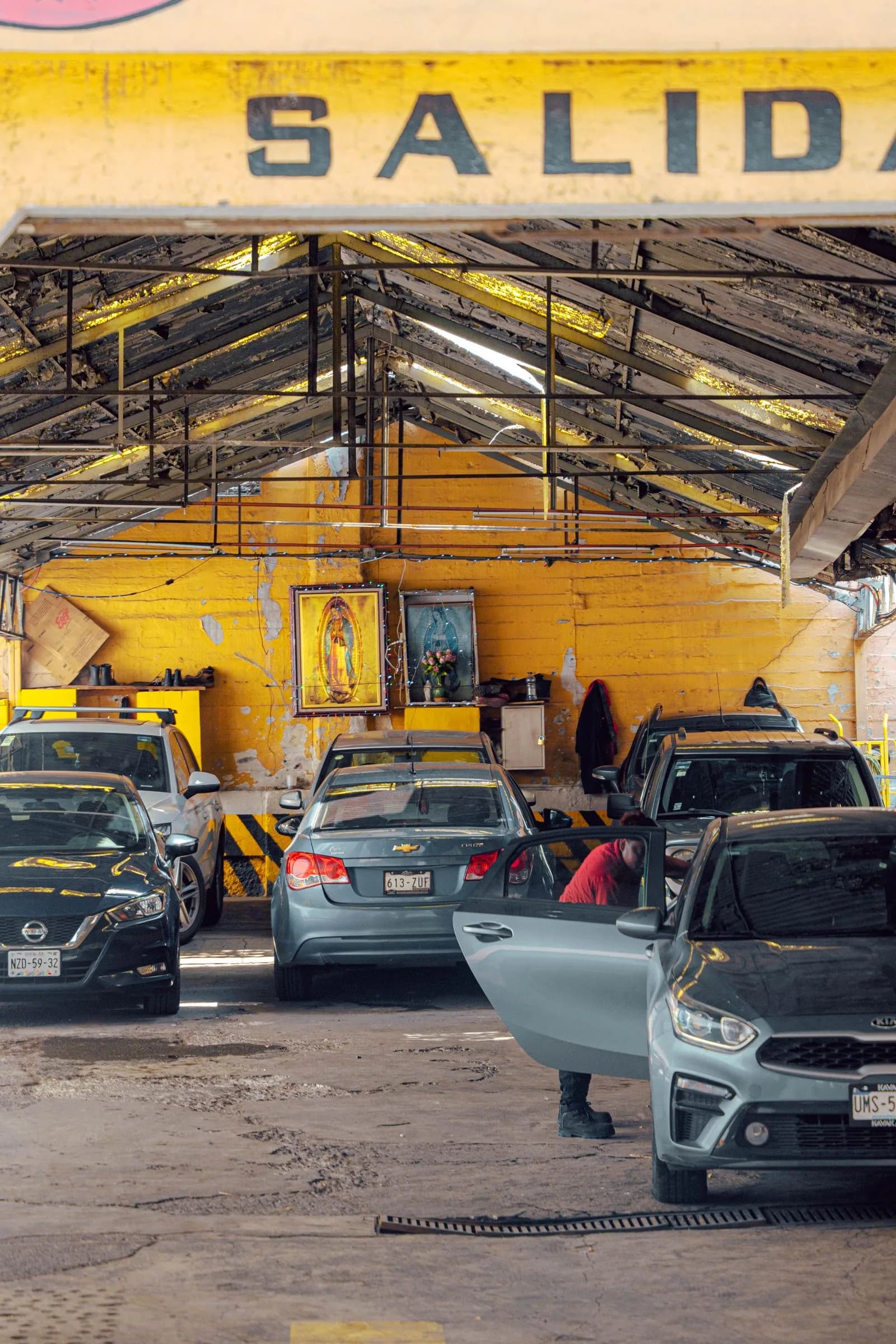 Cars parked inside an auto repair shop