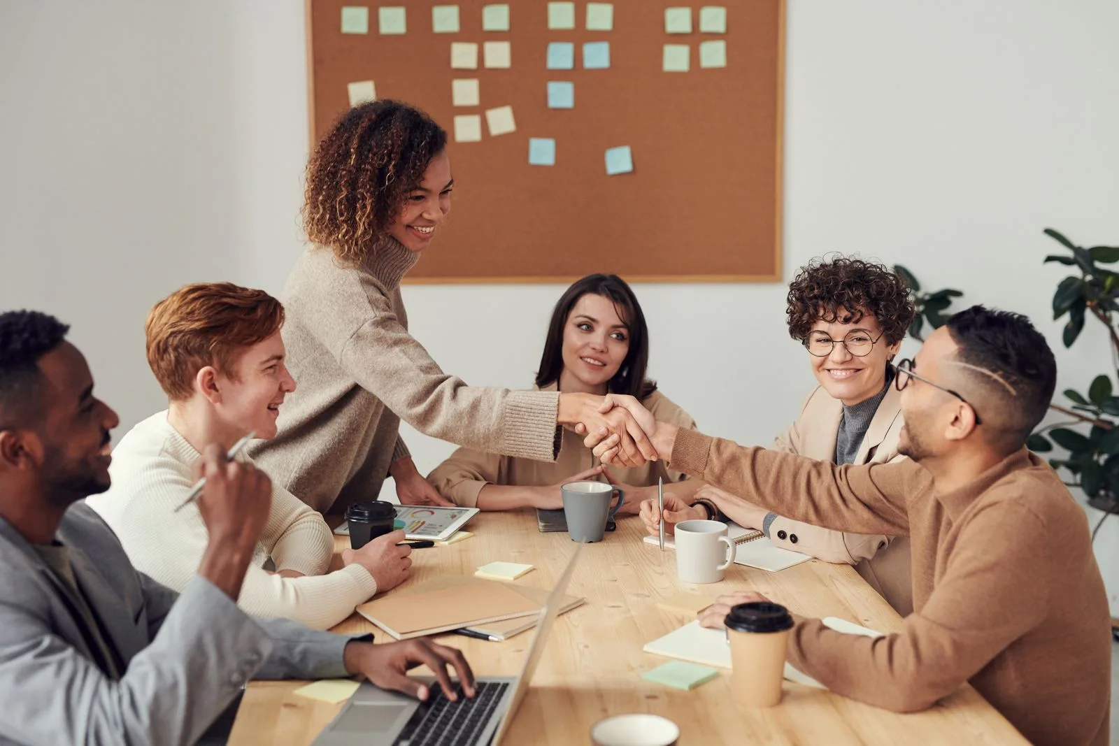 People meeting around a table to plan a community program
