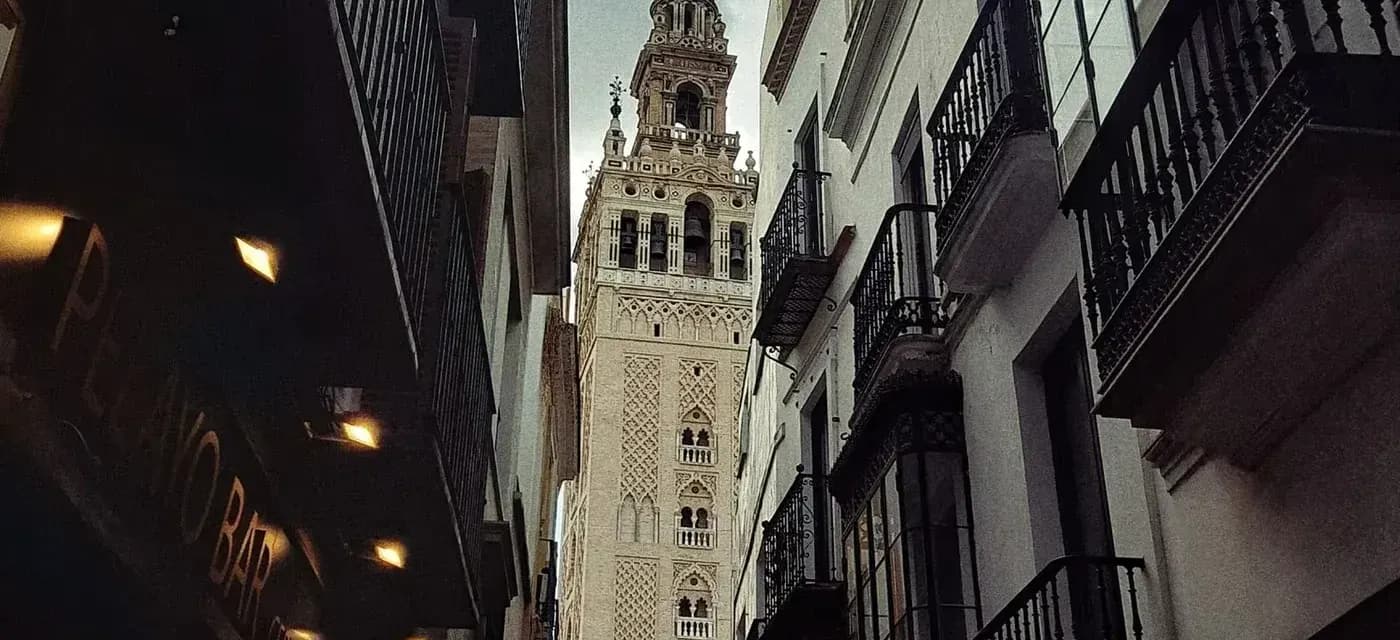 A Seville street looking toward La Giralda