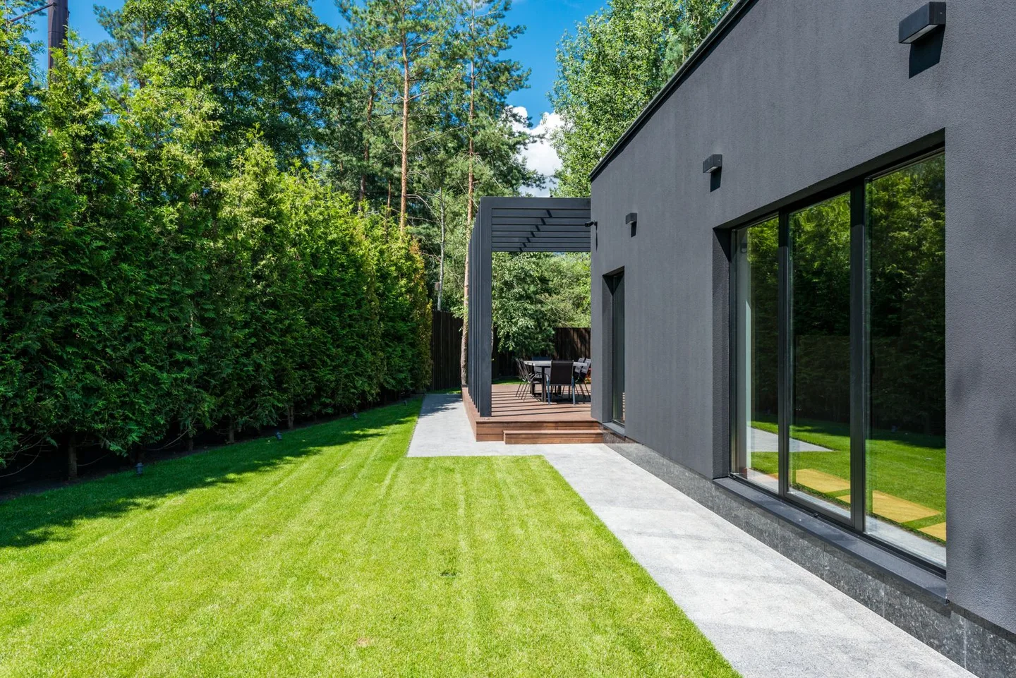 A modern home with a landscaped garden and outdoor terrace